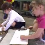 two children draw